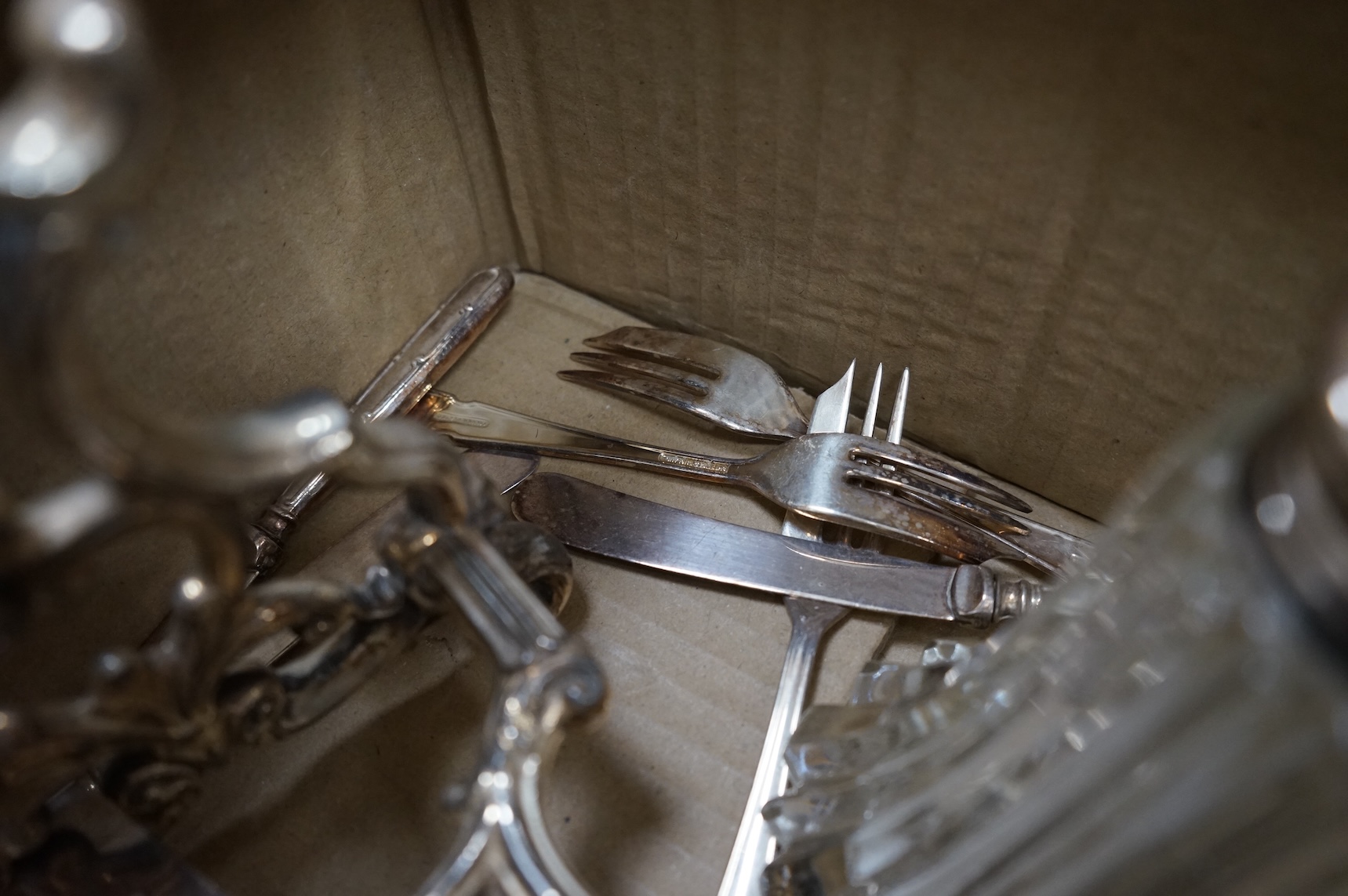 A plated tea kettle and other assorted plated ware.